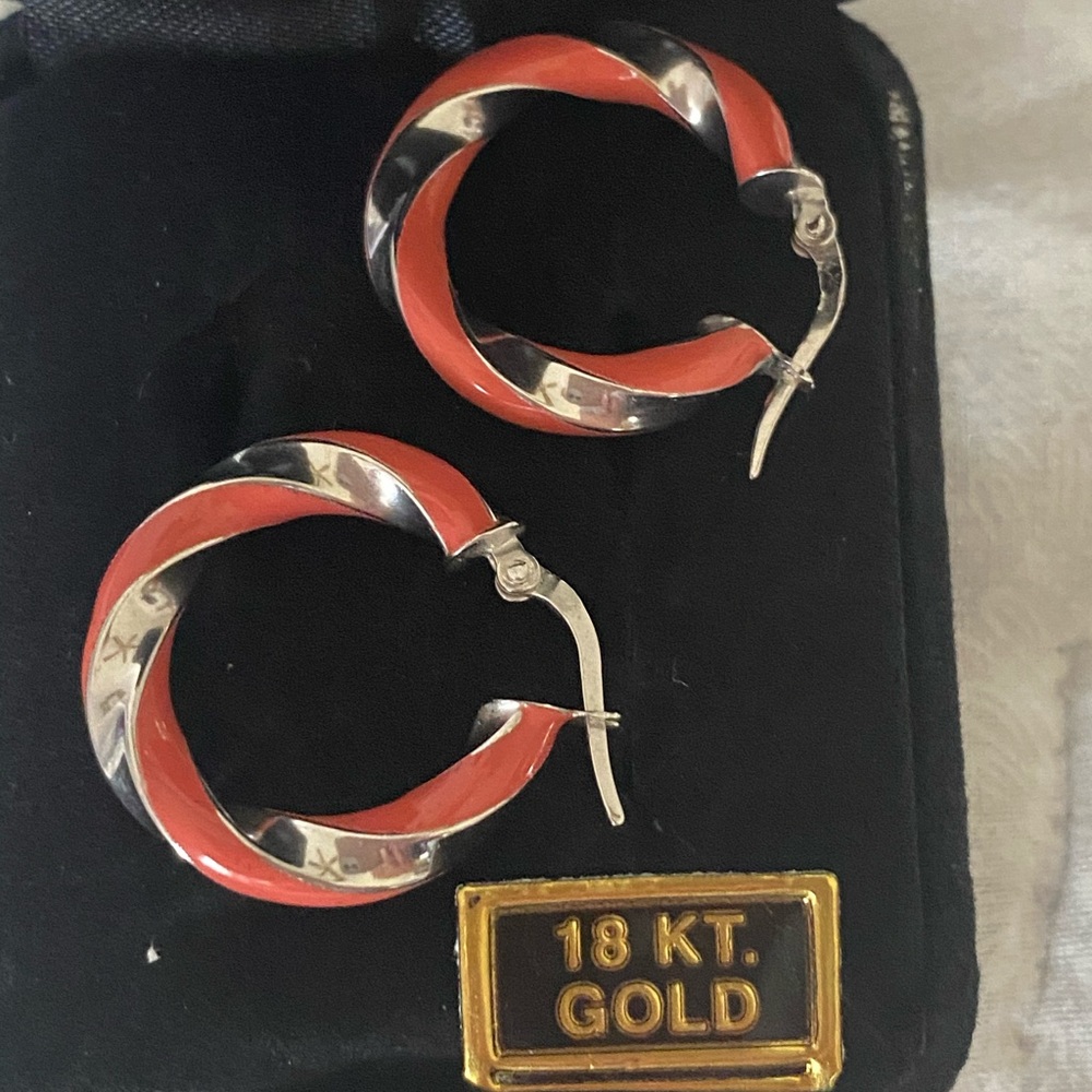 18k white gold earrings with coral enamel.